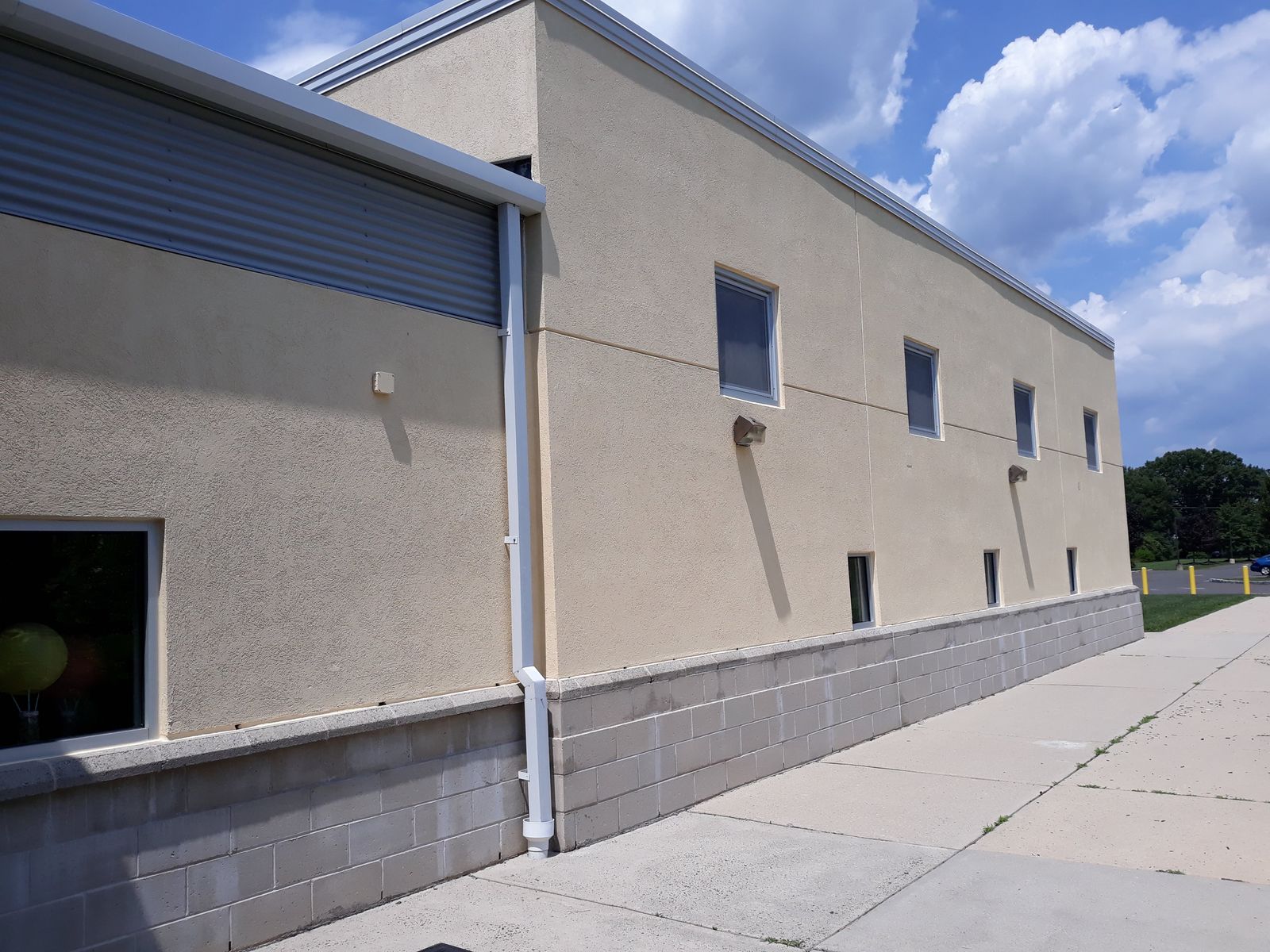 Commercial building exterior with freshly painted stucco walls