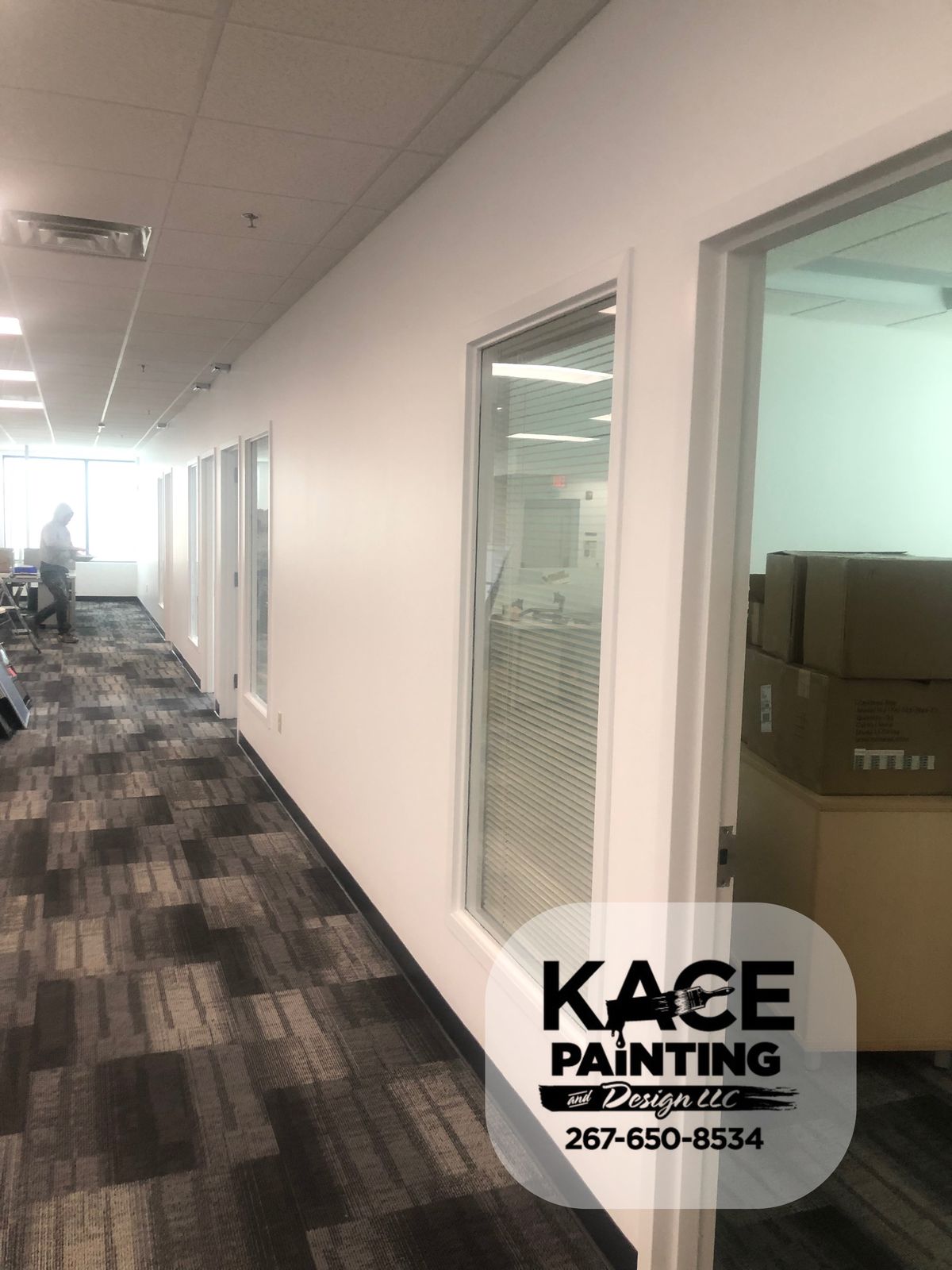Office interior with glass partitions and newly painted walls