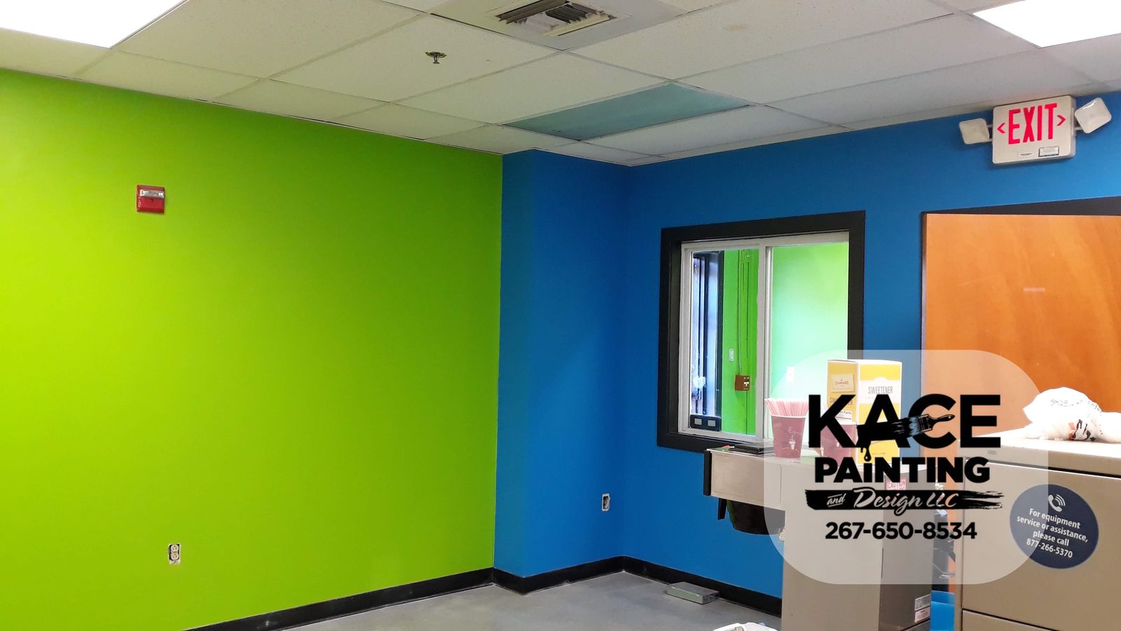 Green and blue accent walls in a commercial workspace