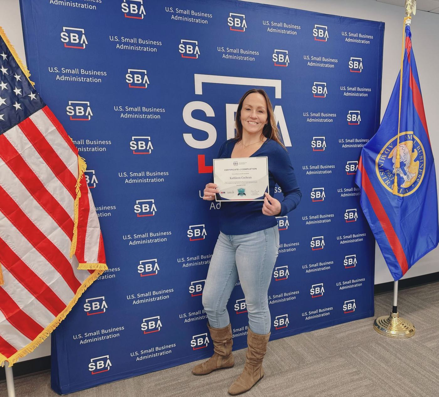 Kathy Cochran at an SBA event with her THRIVE certificate
