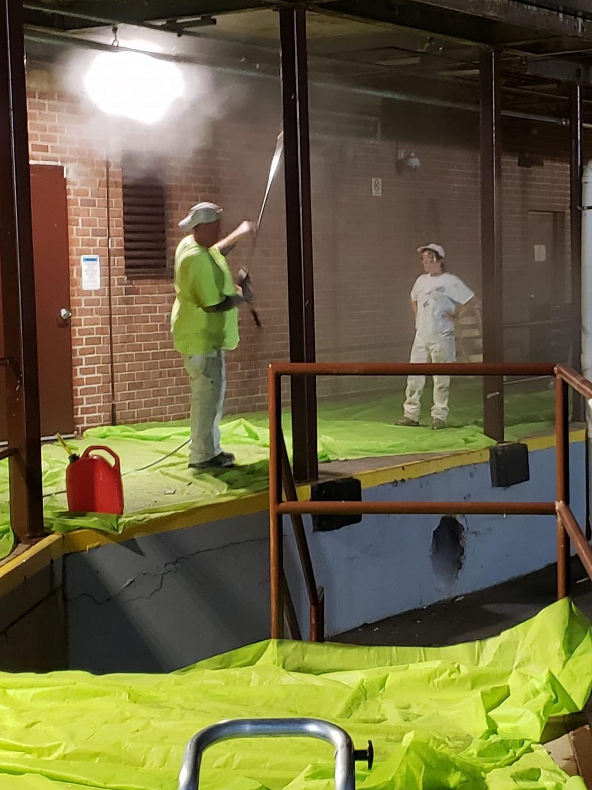 Exterior work area tented and masked for spray application