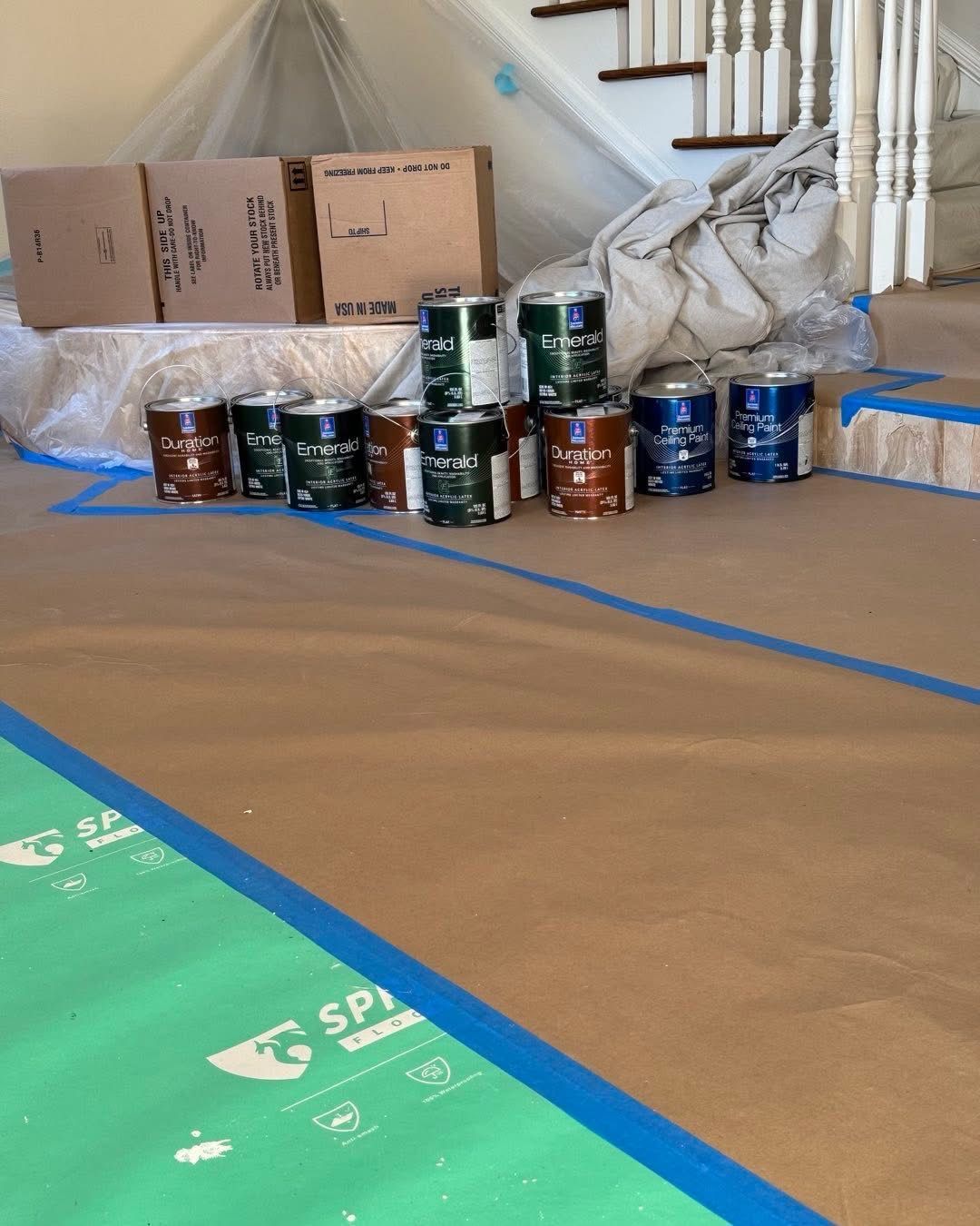 Floors papered and taped with paint staged for an interior job