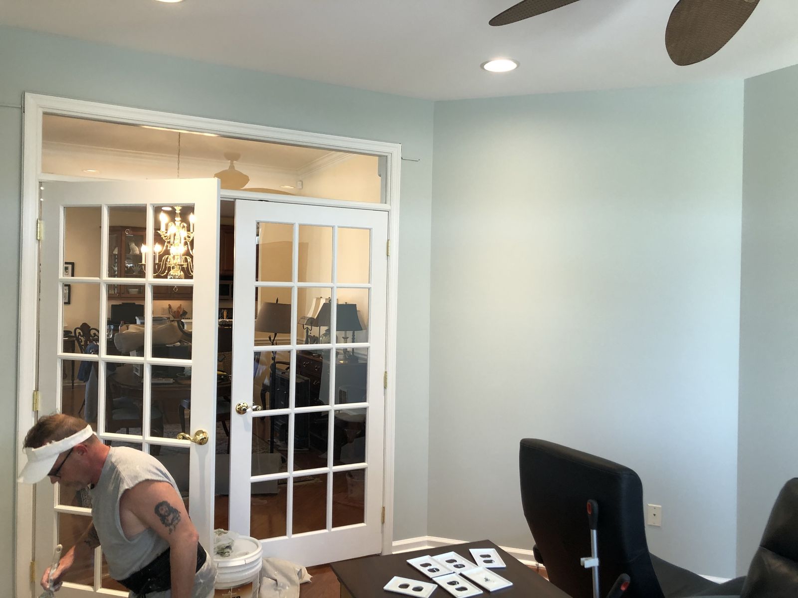 Sunroom with French doors and pale blue walls