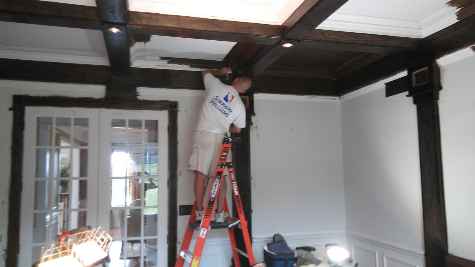 Coffered ceiling and dark painted beams in a living room