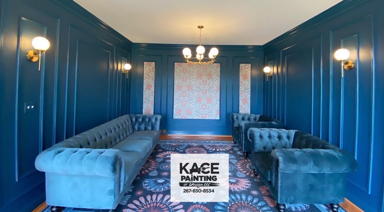 Dining room with botanical wallpaper and teal walls by KACE Painting